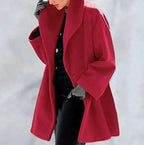 Mandotos chic multi-shade oversized cardigan with a relaxed fit, featuring various colorful knit sections and cozy long sleeves.