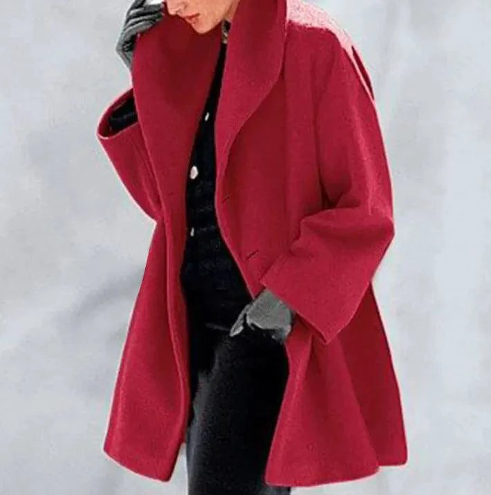 Mandotos chic multi-shade oversized cardigan with a relaxed fit, featuring colorful, layered knit patterns for cozy style.