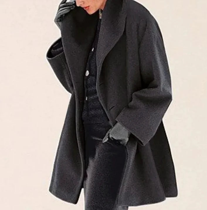 Mandotos chic multi-shade oversized cardigan with relaxed fit, featuring a colorful, cozy knit design and long sleeves.