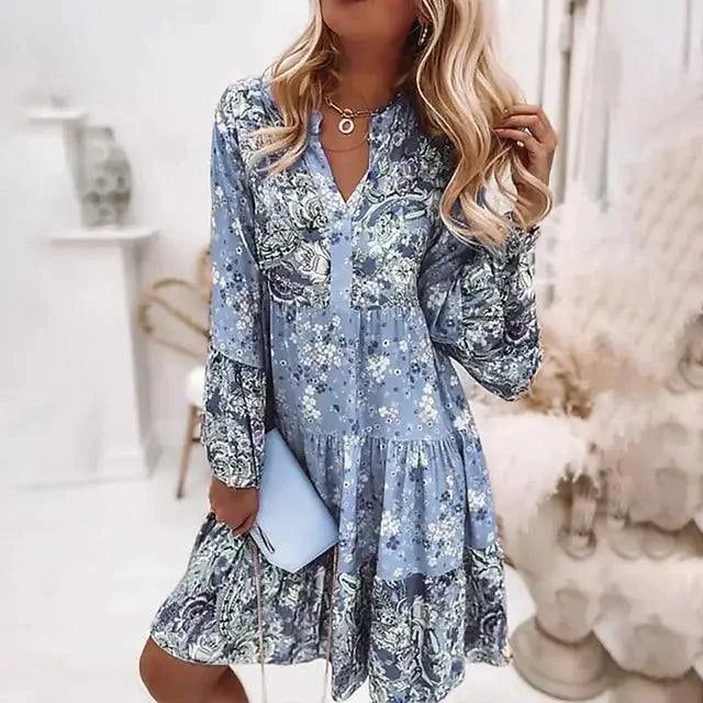 Mandotos chic pleated long sleeve dress with a flowy silhouette and elegant design, perfect for sophisticated occasions.
