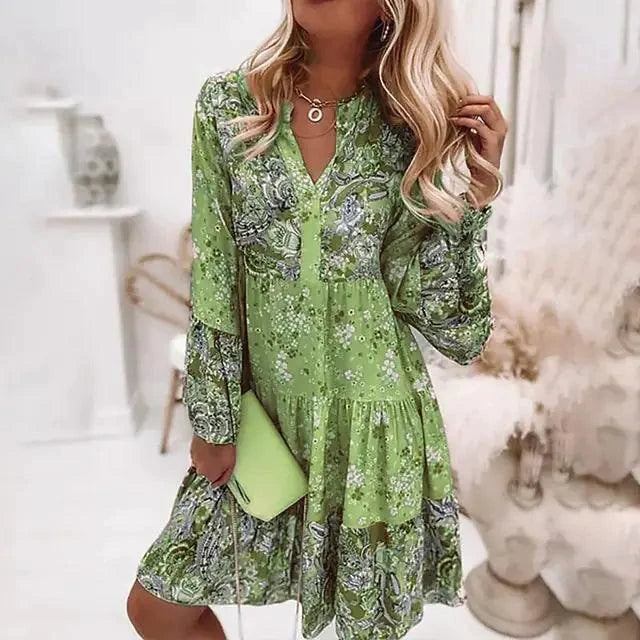 Mandotos chic pleated long sleeve dress with elegant design, featuring flowing fabric and a stylish silhouette.