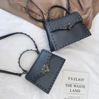Mandotos chic PU leather sling bag with adjustable strap and minimalist design, perfect for casual or dressy occasions.