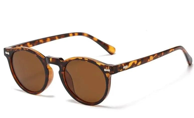 Mandotos chic round UV-block sunglasses with black frames and dark lenses for stylish sun protection.
