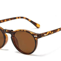 Mandotos chic round UV-block sunglasses with black frames and dark lenses, stylish eyewear for sun protection.