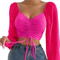 Mandotos chic V-neck crop top with balloon sleeves, lightweight fabric, and stylish design for casual or trendy outfits.