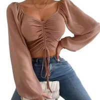 Mandotos chic V-neck balloon sleeve crop top shown on model, stylish and trendy fashion top for casual or dressy wear