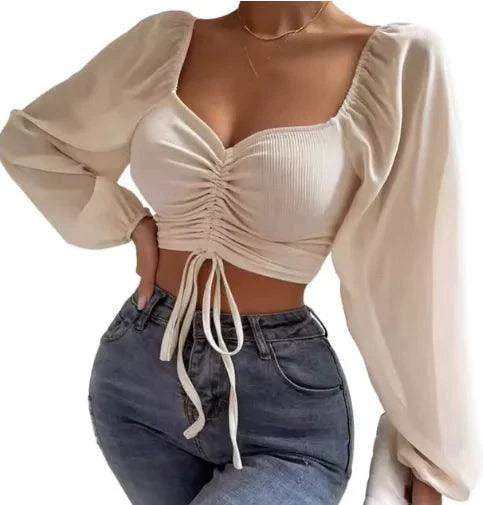 Mandotos chic V-neck crop top with balloon sleeves, stylish and trendy fashion piece for casual or dressy looks.