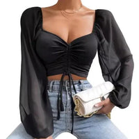 Mandotos chic V-neck balloon sleeve crop top in black, featuring a stylish cropped design and voluminous sleeves.