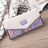 Mandotos women's leather clutch wallet with card holder, featuring a sleek, stylish design in black leather.