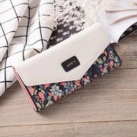 Mandotos chic women's leather clutch wallet and card holder with sleek design and multiple compartments for cards and cash.