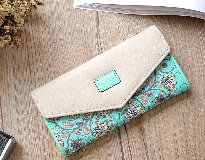Mandotos chic women's leather clutch wallet and card holder with multiple card slots and a sleek design.