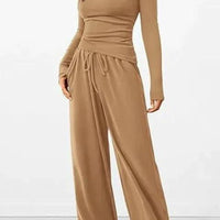 Mandotos City Comfort Asymmetrical Ensemble featuring a stylish, modern design with layered fabric and neutral tones.