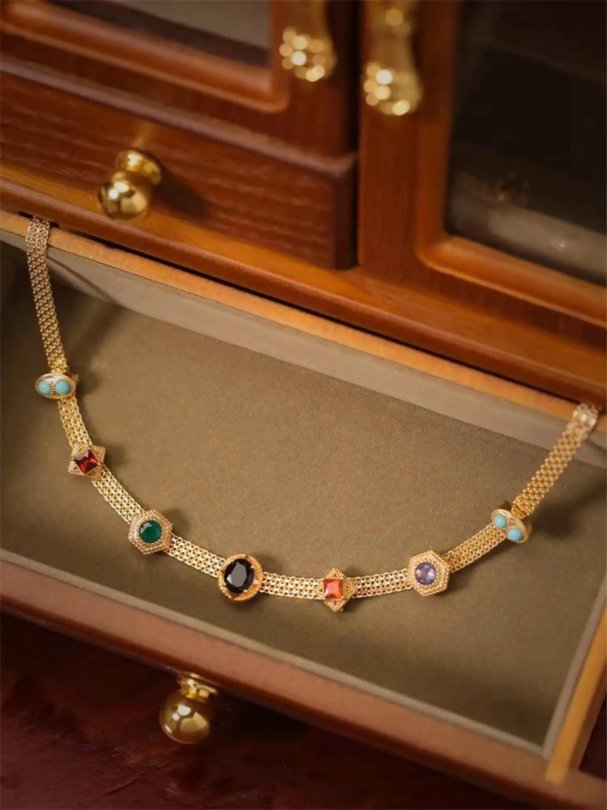 Vintage 14K gold choker necklace from MANDOTOS featuring a classic, elegant design with a polished finish.