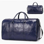 Mandotos classic leather duffel bag with sturdy handles and spacious interior, made from high-quality brown leather.