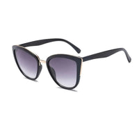 Mandotos Cleo Cat Eye Shades featuring black frames and tinted lenses, stylish eyewear for a trendy look.