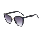 Mandotos Cleo Cat Eye Shades with black frames and tinted lenses, stylish eyewear for a fashionable look.