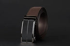 Mandotos contemporary leather belt with a sleek design, featuring a polished metal buckle and smooth brown leather strap.