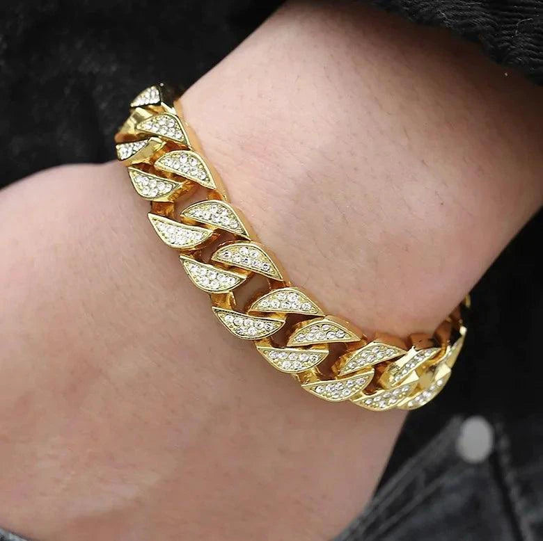 Gold Cuban curb bracelet by MANDOTOS featuring thick interlocking links, stylishly displayed on a white background.