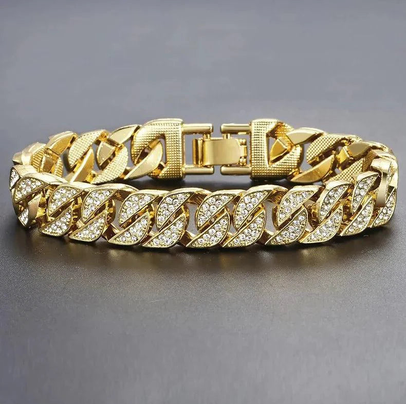 Close-up of a gold Cuban curb bracelet by MANDOTOS, showcasing its sleek, interconnected links and polished finish.
