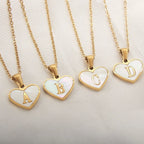 Mandotos white shell heart-shaped letter necklace with 26 customizable letters, delicate clavicle chain jewelry for women.