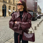 Mandotos women's loose lapel leather jacket with cropped streetwear style, perfect for casual fashion and layered looks.