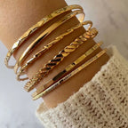 Mandotos Bohemian metal chain bracelet set for women with six gold-colored geometric thick link bangles on a white background.