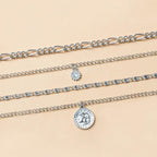 Mandotos chunky gold layered necklace featuring a coin pendant and sun charm for women, stylish jewelry accessory.