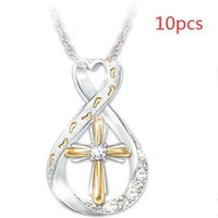 Mandotos cross footprint diamond pendant necklace in two-tone gold with intricate design and sparkling diamonds.