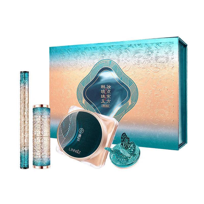 Mandotos Oriental Beauty Co. Chinese-inspired makeup set with elegant palette and bold colors, showcasing eyeshadows and brushes.