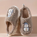 Mandotos snowman slippers for winter, plush cozy home shoes with anti-slip soles for couples, featuring festive snowman design.