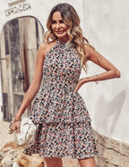 Mandotos summer printed halter dress with boho backless design, ruffled A-line silhouette, perfect for beachwear and casual wear.