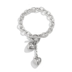 Mandotos thick chain necklace with lock and key pendant, trendy fashion jewelry piece showcasing bold design and metallic finish.