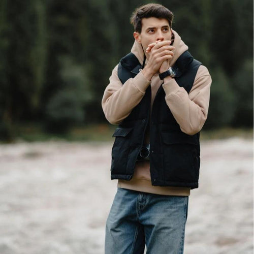 White duck down vest by MANDOTOS, a men's three-proof jacket with insulated, lightweight design and waterproof, windproof features.