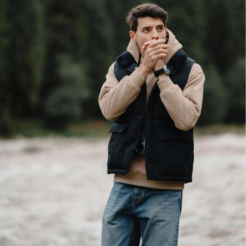 White duck down vest by MANDOTOS, a men's three-proof jacket featuring insulated, lightweight, and durable design.