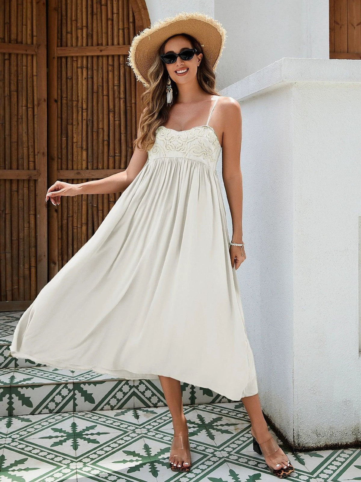 Mandotos women's bohemian maxi dress with embroidered bust, elastic back, breathable rayon fabric, and flowy skirt in black, white, and green.