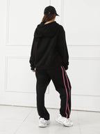 Women's long-sleeved hoodie set by MANDOTOS, featuring a comfortable, casual fit with a hood and matching pants.