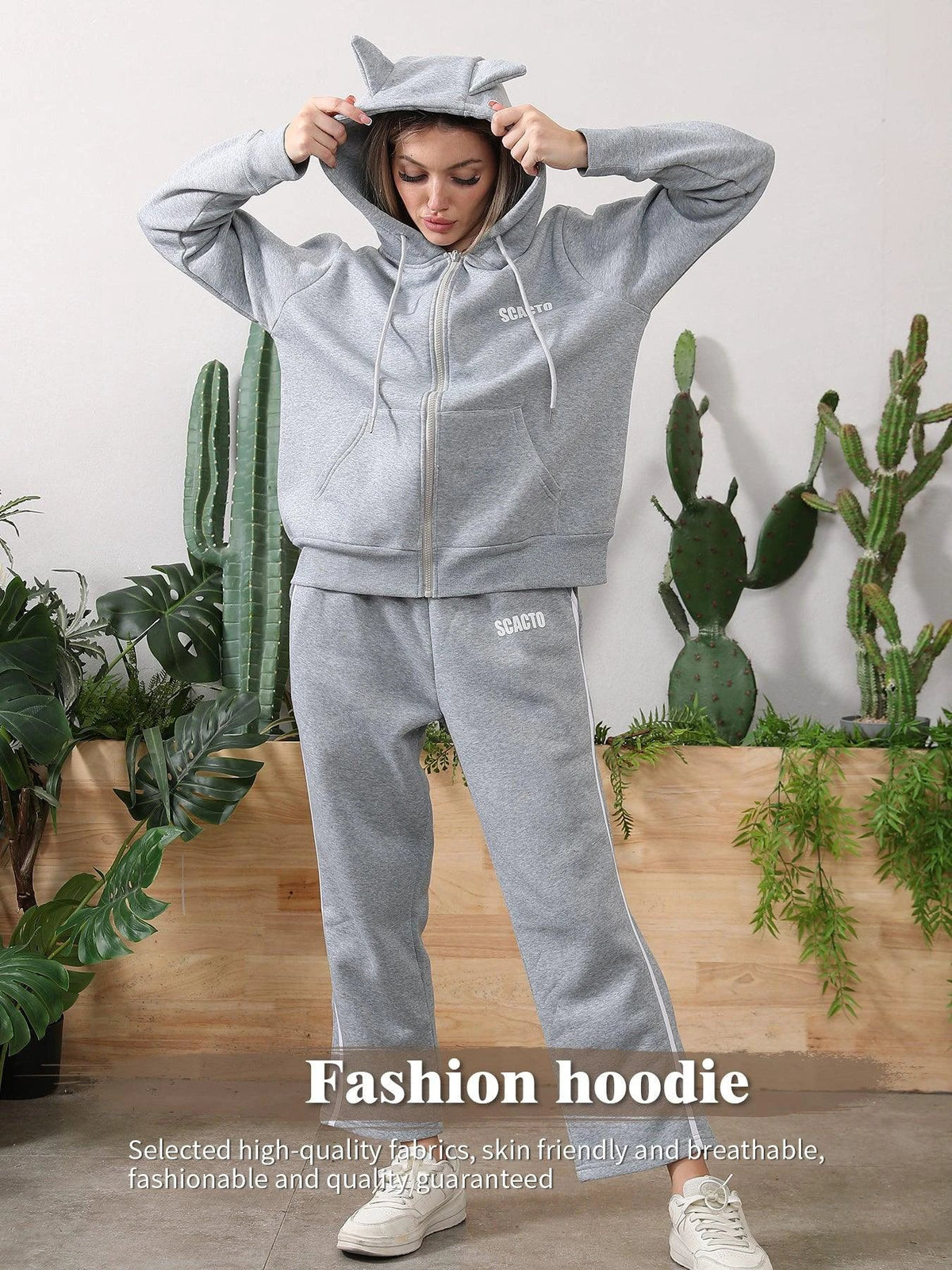 Women's long-sleeved hoodie set by MANDOTOS, featuring a comfortable matching top and pants in soft fabric.