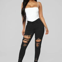 Mandotos denim pencil pants for women, slim long trousers with ripped holes and stretch fabric, featuring tapered legs and fitted style.