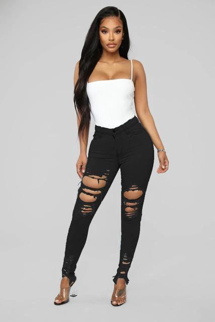 Mandotos denim pencil pants for women, slim long trousers with ripped holes and stretch fabric, featuring tapered legs and fitted style.