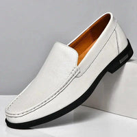 Mandotos Eco-Chic Leather Loafers featuring smooth brown leather, classic slip-on design, and stylish stitching details.