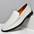 Mandotos Eco-Chic Leather Loafers featuring sleek design, brown leather, and comfortable slip-on style for casual or office wear.