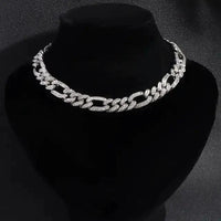Elegant cubic zirconia Cuban necklace by MANDOTOS featuring sparkling stones and a bold chain design.