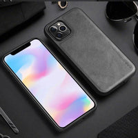 Elegant leather iPhone shield by MANDOTOS, showcasing a sleek, handcrafted protective case with smooth leather finish and precise cutouts.