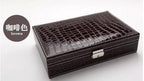 Elegant leather vanity case by MANDOTOS with a sleek design and leather handle, perfect for travel and organization.
