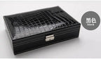 Elegant leather vanity case by MANDOTOS featuring a sleek design with a handle and secure clasp, perfect for travel and beauty essentials.