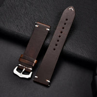 Elegant leather watch band by MANDOTOS featuring smooth brown leather and metal buckle for a stylish accessory.