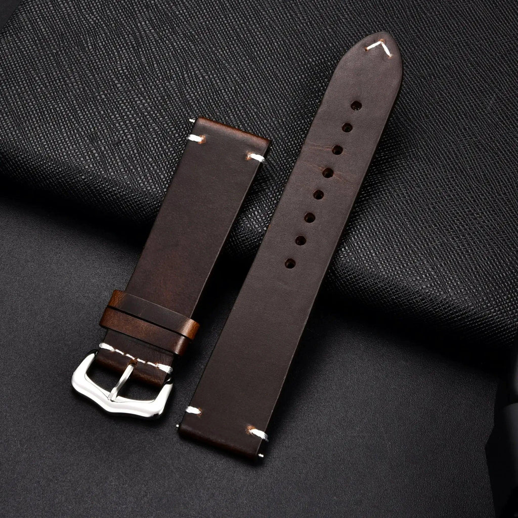 Elegant leather watch band by MANDOTOS, showing a close-up of the stylish, brown leather strap with stitched detailing.