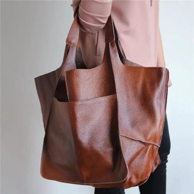 Elegant women's tote bag by MANDOTOS with structured design, leather handles, and spacious interior for everyday use.