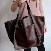 Elegant women's tote bag by MANDOTOS, featuring sleek design and spacious interior, perfect for daily use and stylish accessories.