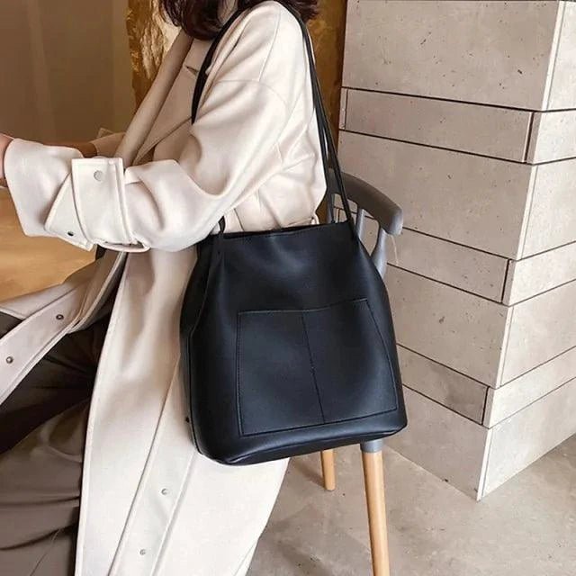 Elegant women's tote bag by MANDOTOS with structured design and top handles, perfect for stylish everyday use.